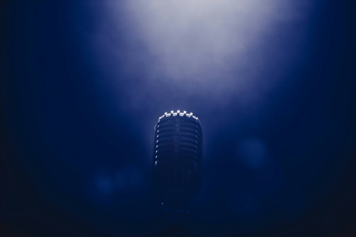 Professional podcast services and producers editing audio in a sound-treated studio